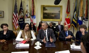Brittany Packnett sits beside President Obama at the White House to discuss civil rights. Photograph: Carolyn Kaster/AP
